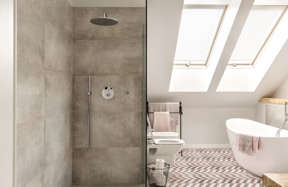 Modern attic bathroom- concrete shower and freestanding bath