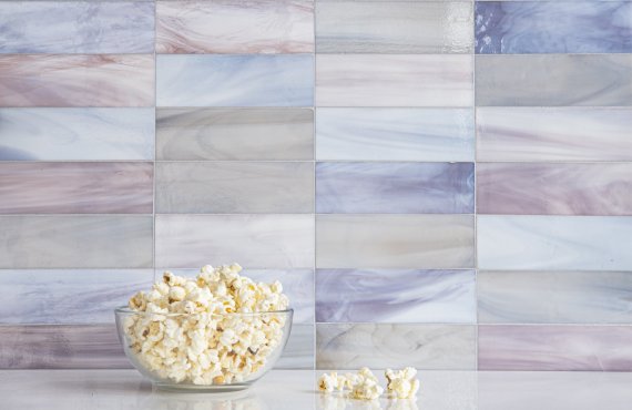 Bricks 2"x 6", a hand-cut jewel glass mosaic, shown in Lace Agate, Desert Rose, and Galena, is part of the Heritage Collection by New Ravenna.