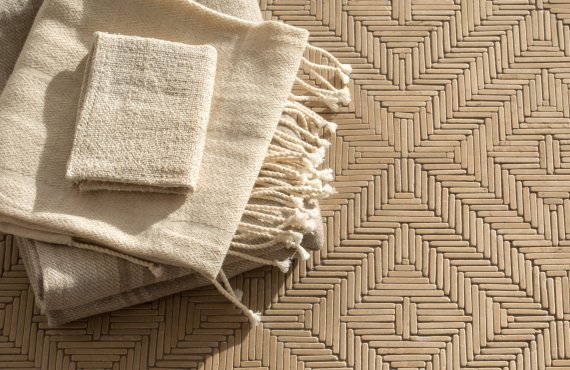 Rattan, a hand-cut tumbled mosaic, shown in Lagos Gold, is part of the Tissé® collection for New Ravenna.