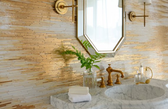 Reve, a handmade mosaic shown in 24K Gold Glass and Agate and Quartz Jewel Glass, is part of the Aurora® collection by New Ravenna.

-Sink featured courtesy of Stone Forest.