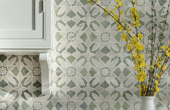 Valencia, a waterjet mosaic, shown in honed Verde Luna and Whitewood, is part of the Miraflores collection by Paul Schatz for New Ravenna.